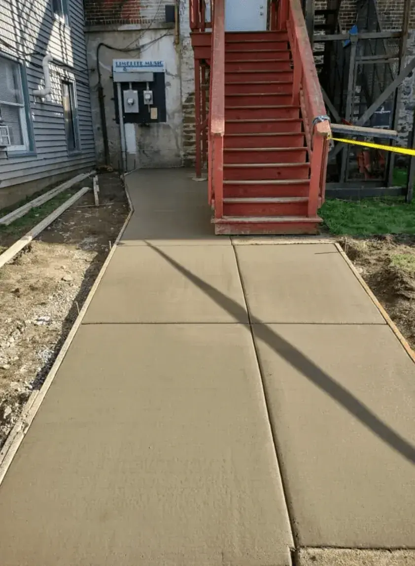 Commercial concrete sidewalk poured for Limelight Music in East Aurora NY by Cornerstone Concrete of WNY