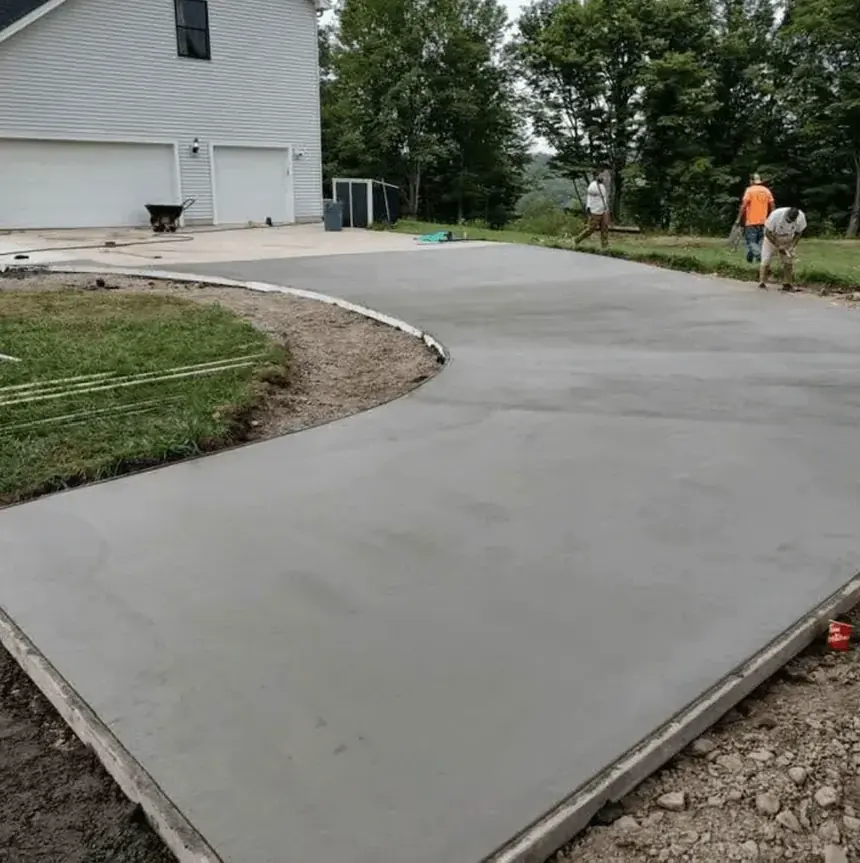 Cornerstone Concrete of WNY crew finishing a freshly poured concrete driveway in Erie County NY