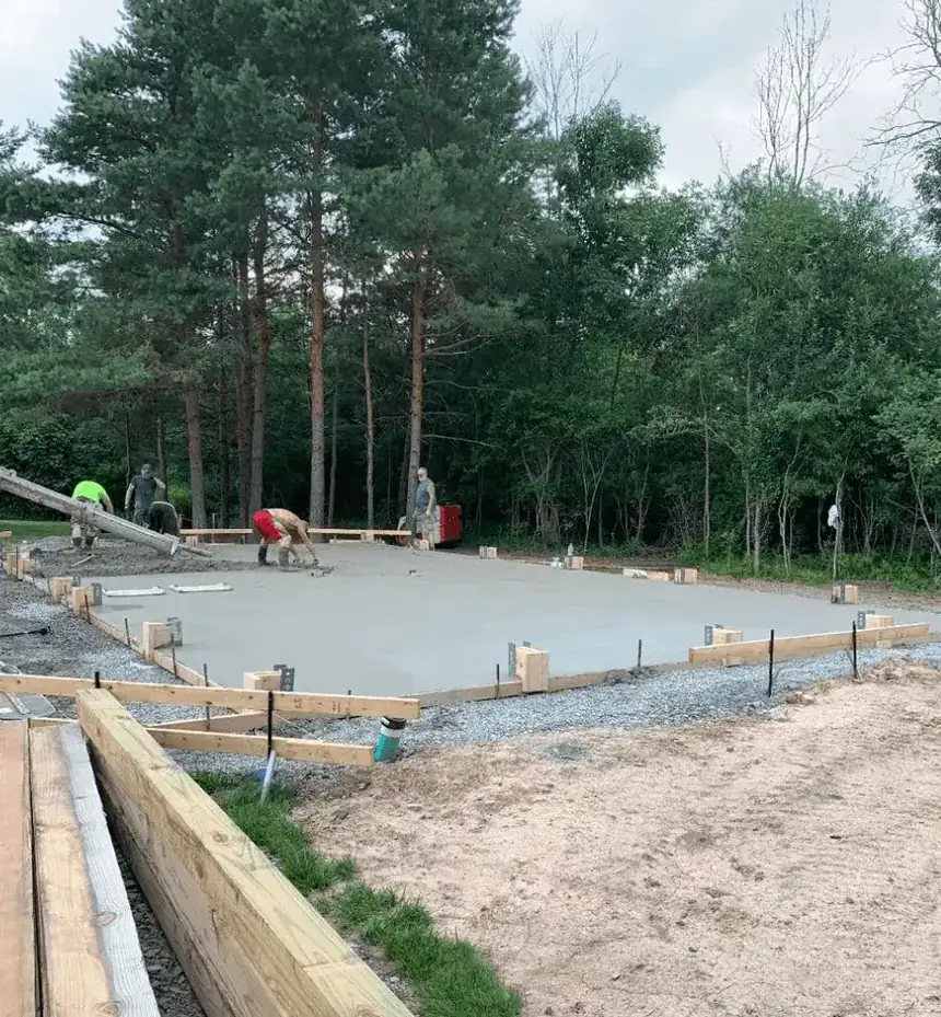 Cornerstone Concrete of WNY crew finishing a formed concrete pad for a metal building in Clarence NY